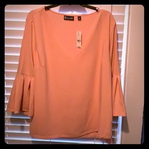 Blouse never worn.  Pretty light pink color